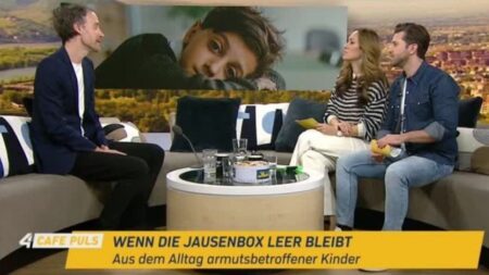 Andreas Rainer im Interview mit Cafe Puls, Text in der Bauchbinde: "Wenn die Jausenbox leer bleibt, Aus dem Alltag armutsbetroffener Kinder"